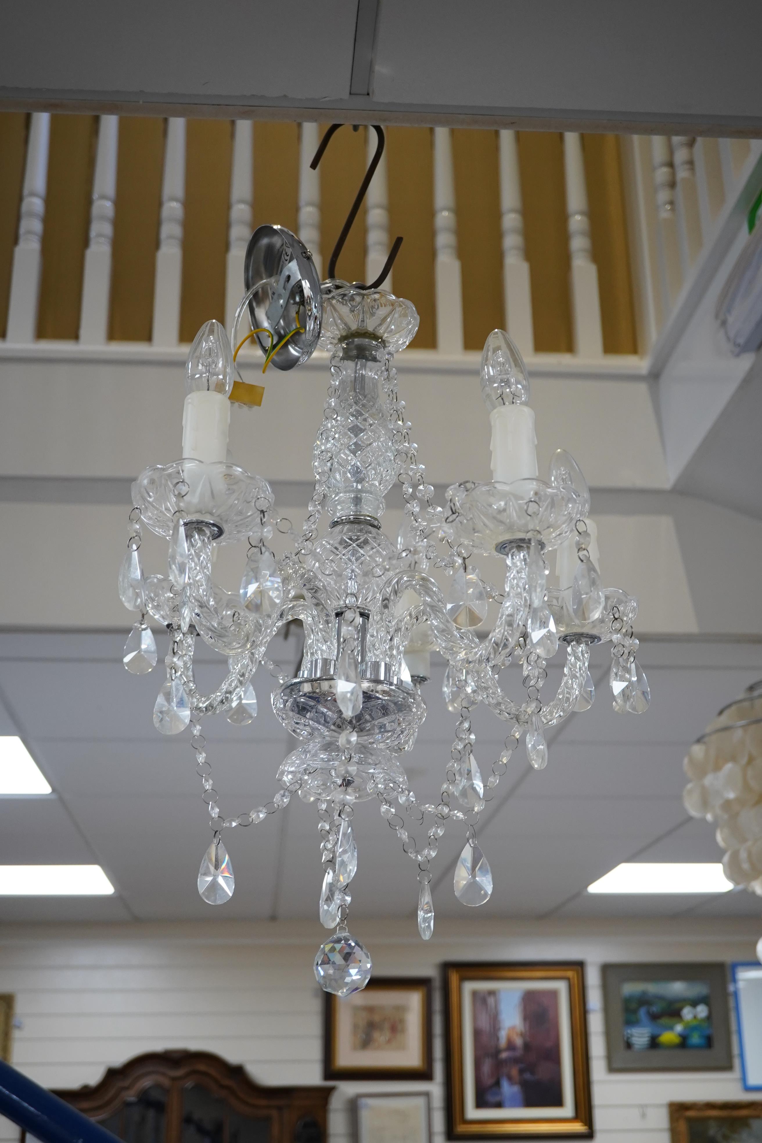 A pair of five branch cut glass chandeliers, approximately 55cm high. Condition - good